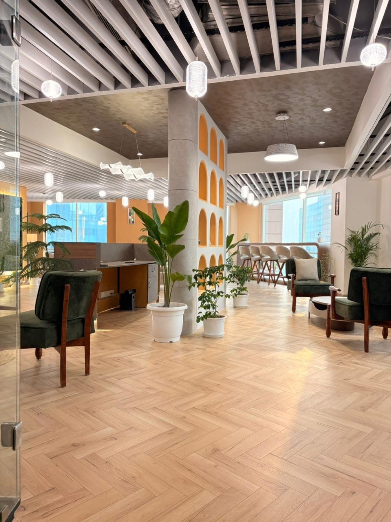 Open lounge at Limelight Coworks with premium seating, plants, and natural light